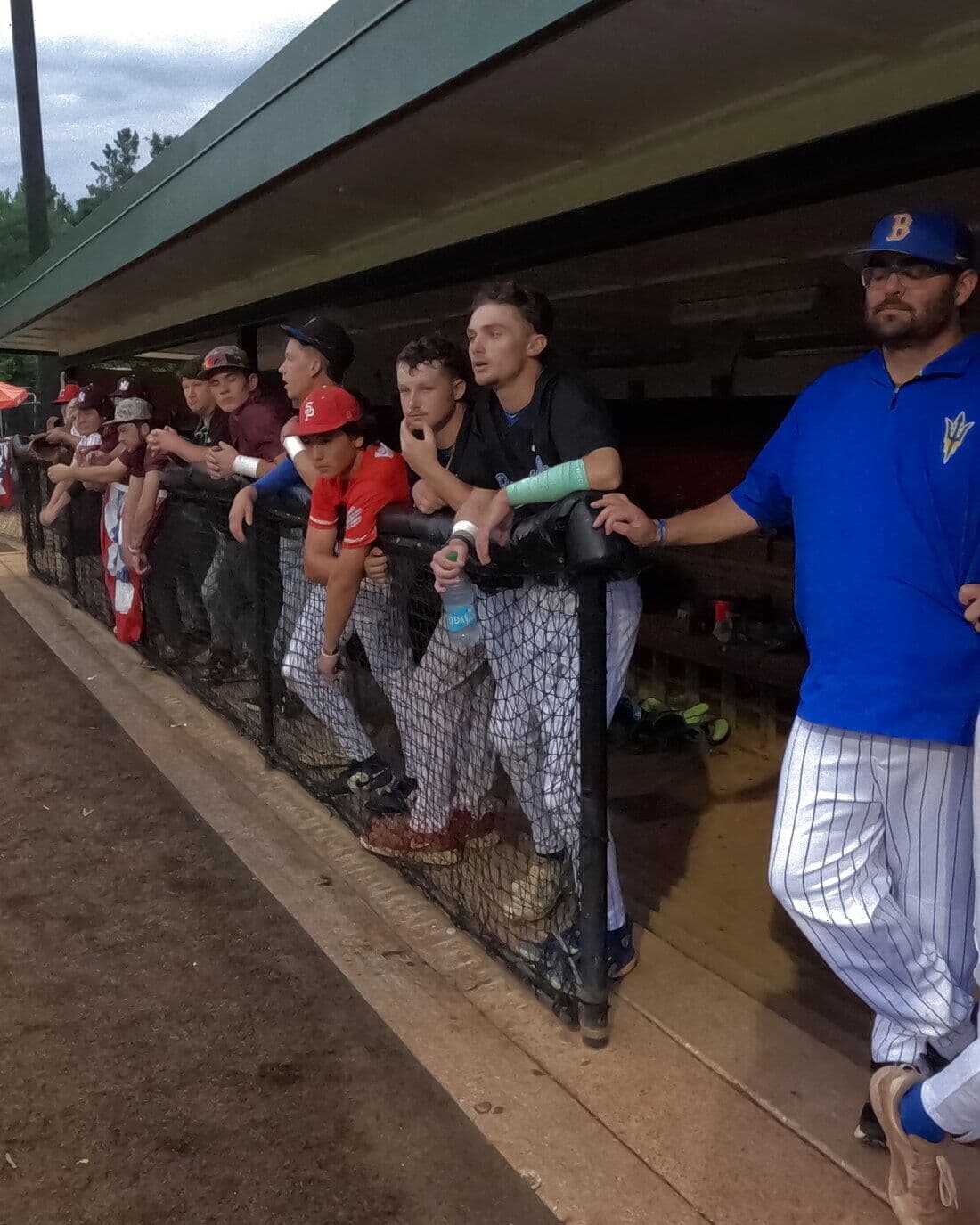 All-Star players line the dugout rail at the 2026 NEMCABB All-Star Games in Corinth