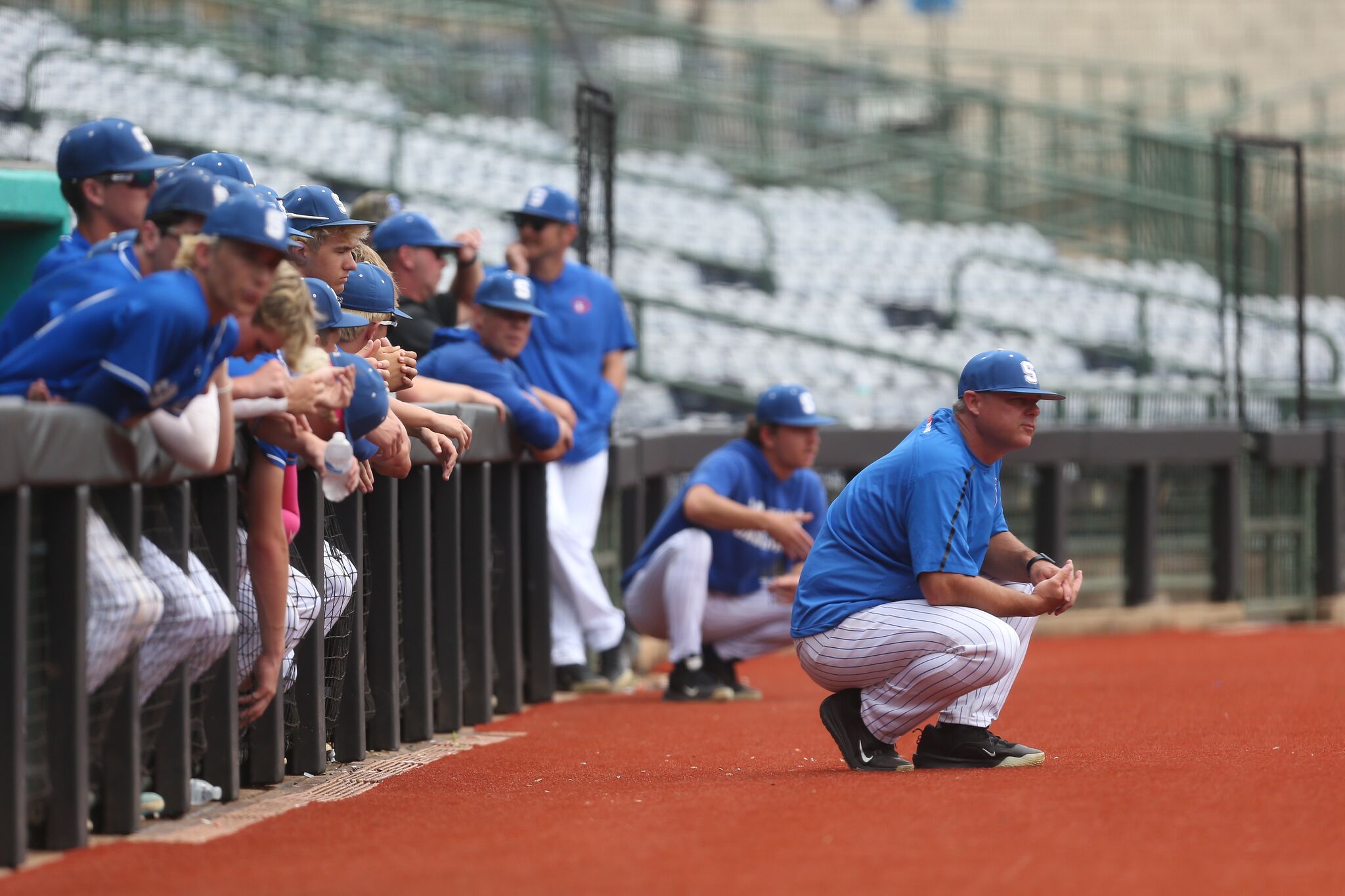 Saltillo's dugout watches the final at Trustmark Park.