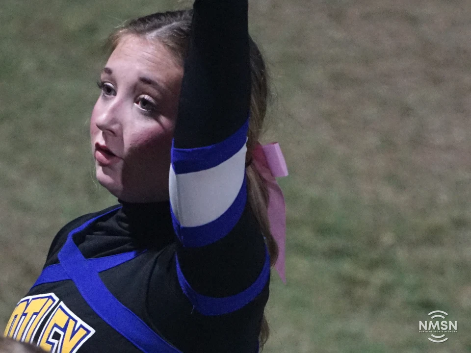A Hatley cheerleader leads a sideline cheer — Hamilton at Hatley, October 30, 2026. Photo: NMSN.