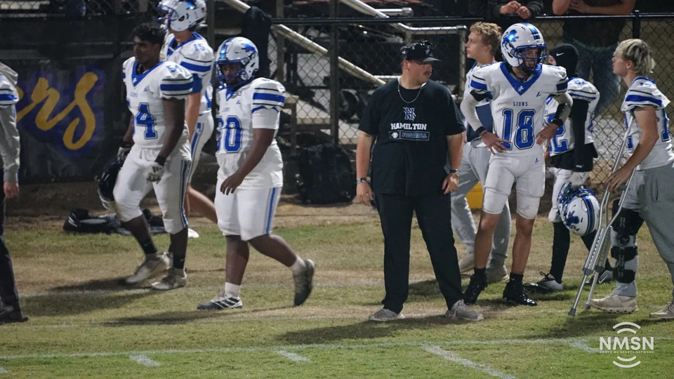 Hamilton players and a coach watch from the sideline — Hamilton at Hatley, October 30, 2026. Photo: NMSN.