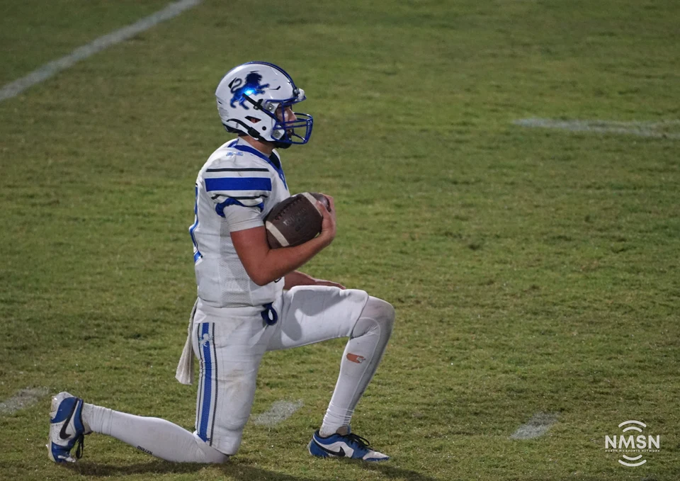 Hamilton quarterback takes a knee late in the game — Hamilton at Hatley, October 30, 2026. Photo: NMSN.