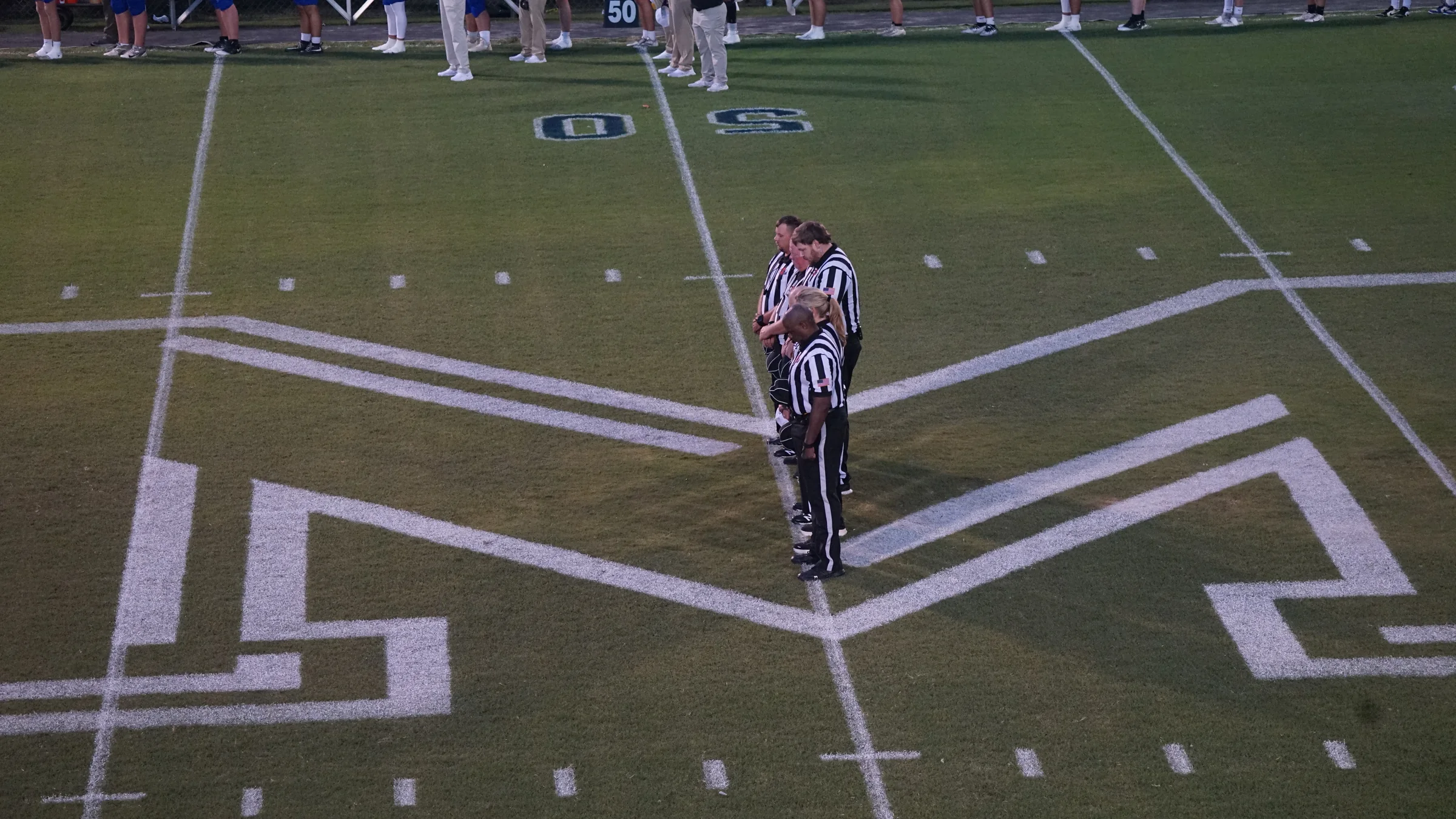 Officials stand at midfield before Hatley and Mantachie met on September 11. Photo by Steven Martinez.