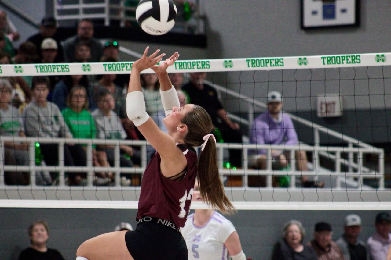 New Albany sets the ball during its 3–0 victory at Mooreville. Photo: Brandon Speck / Hardwired 662.