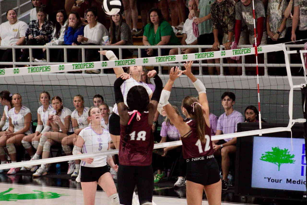 New Albany players challenge a Mooreville attack at the net. Photo: Brandon Speck / Hardwired 662.
